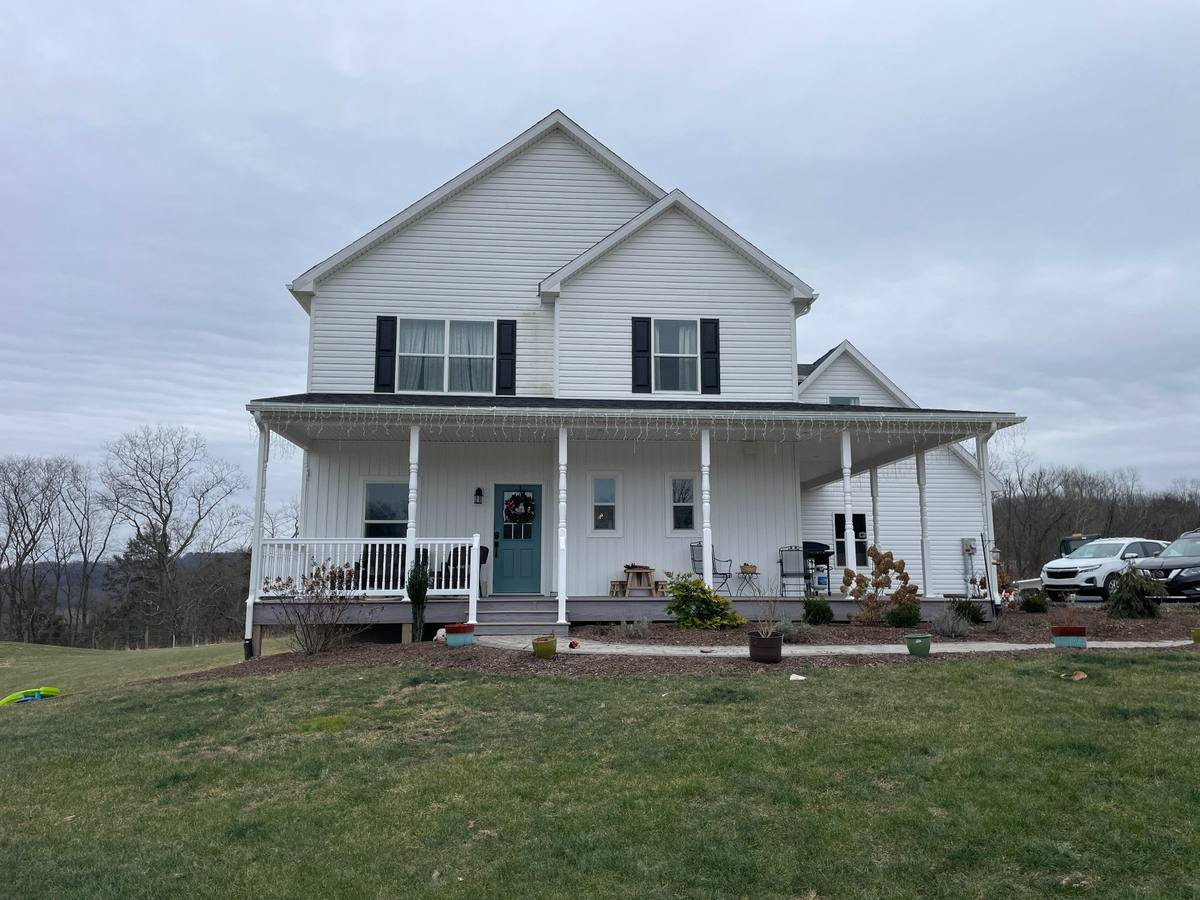 Existing front exterior of rural home before renovation and addition design