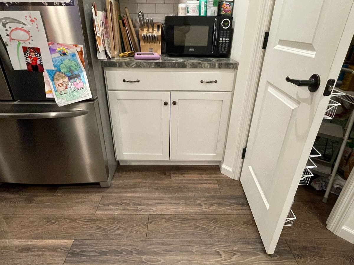 Existing pantry and storage area next to kitchen