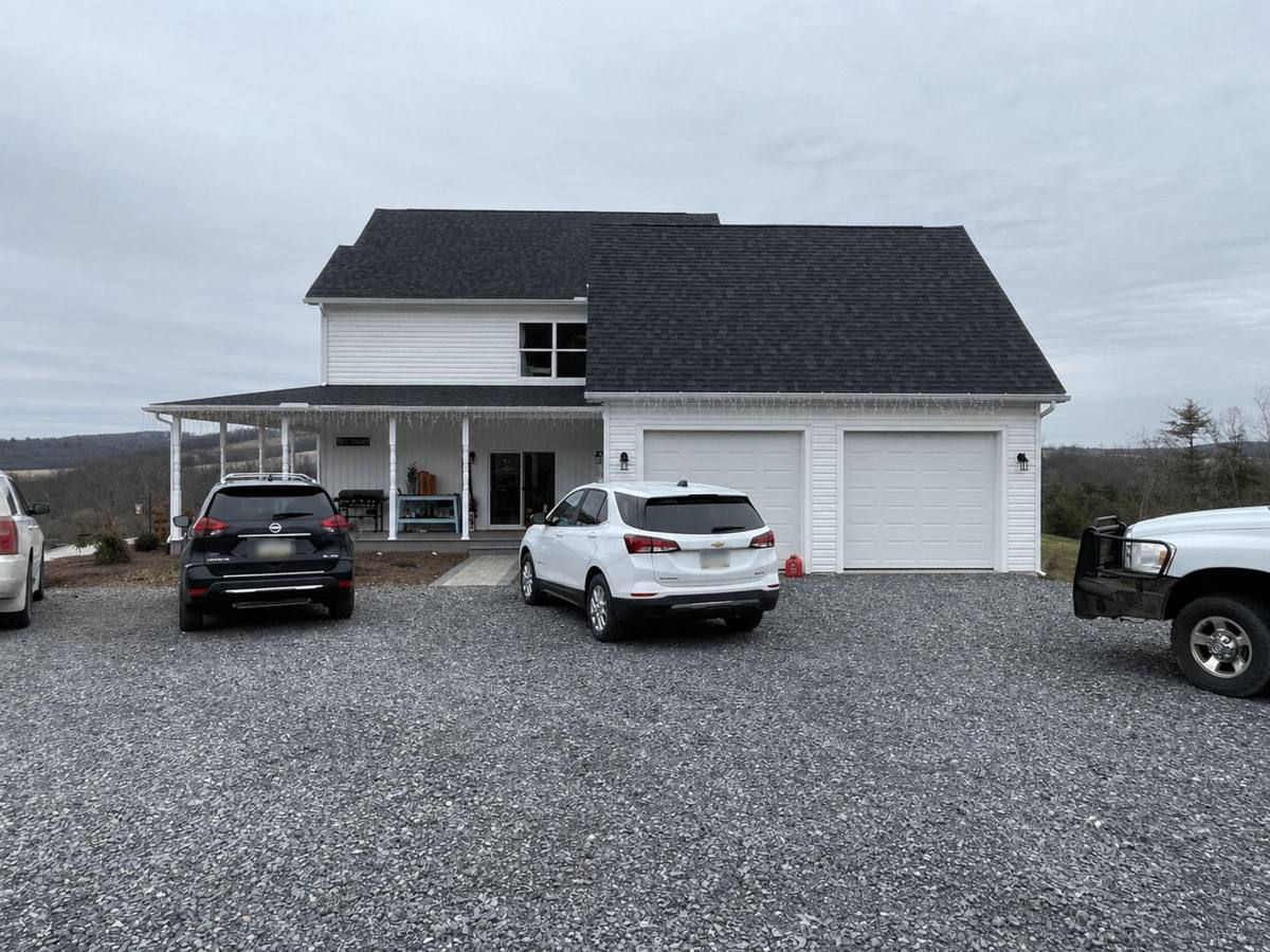 Side of house where the driveway and sliding door created an informal visitor entrance