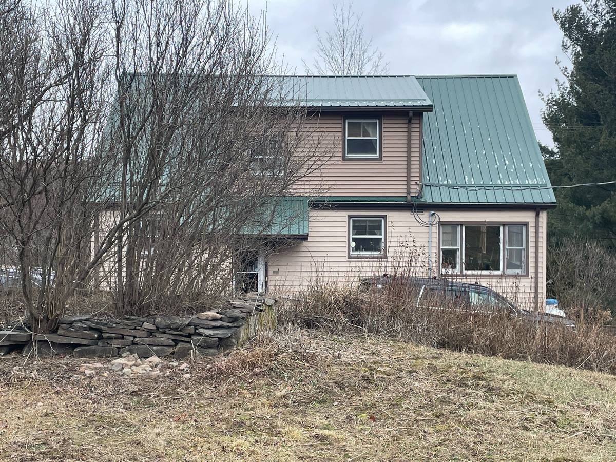 Existing rear exterior and deck area of the Residence