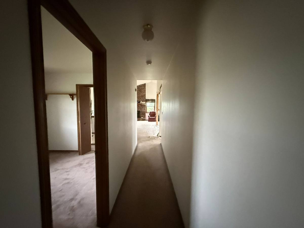 Narrow existing hallway showing circulation limitations